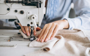 Woman tailor working at the sewing factory